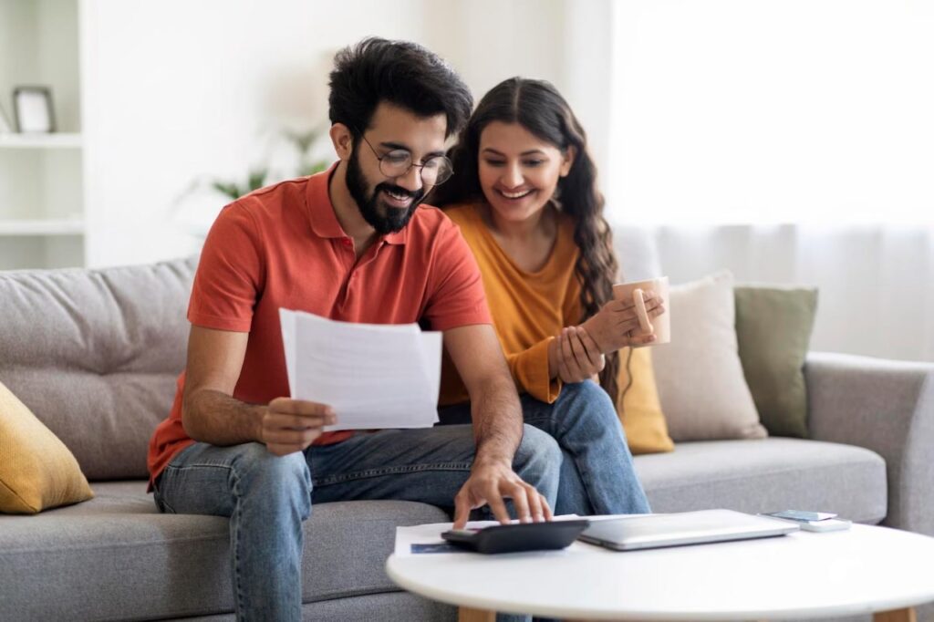 A couple reviewing financial documents for Property Loans.